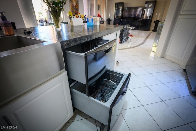 kitchen with light tile patterned flooring