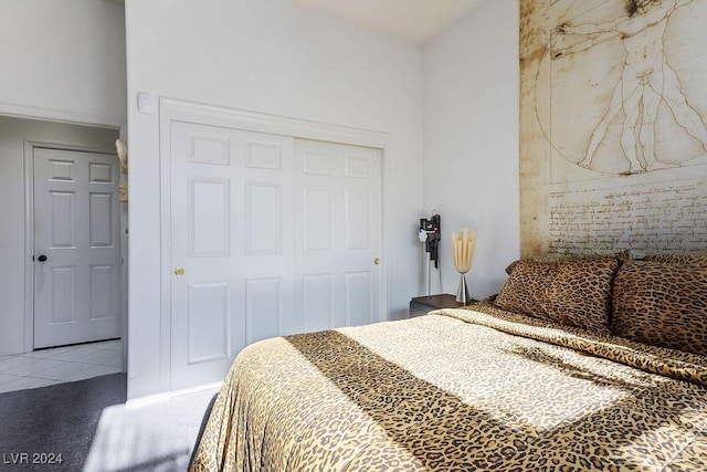 carpeted bedroom featuring a closet