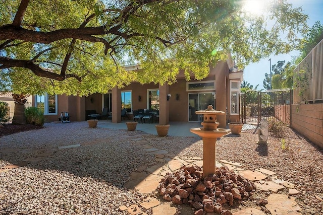 back of property with a patio area