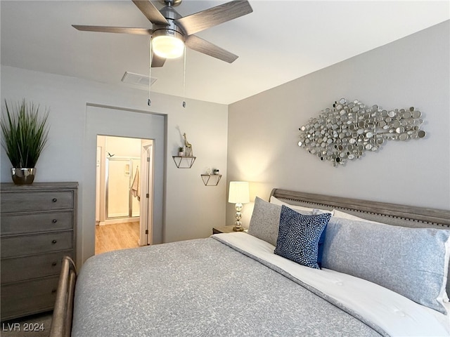 bedroom with ceiling fan and hardwood / wood-style flooring