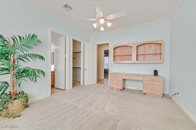 office space featuring light carpet, ceiling fan, and crown molding