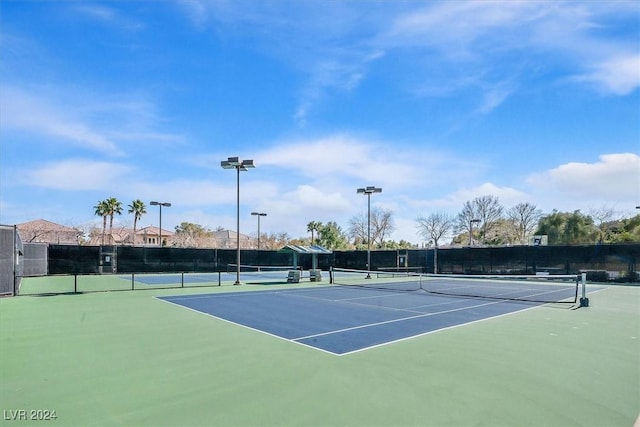 view of tennis court with basketball court