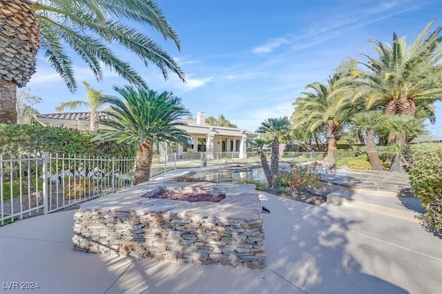 exterior space with a fire pit and a patio area