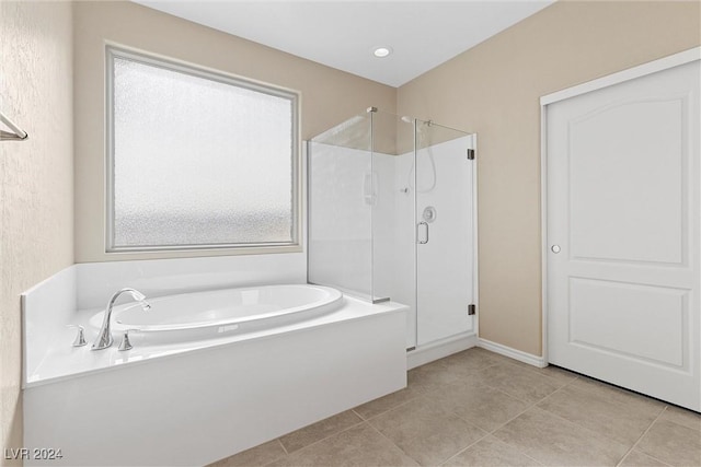 bathroom featuring shower with separate bathtub and tile patterned floors