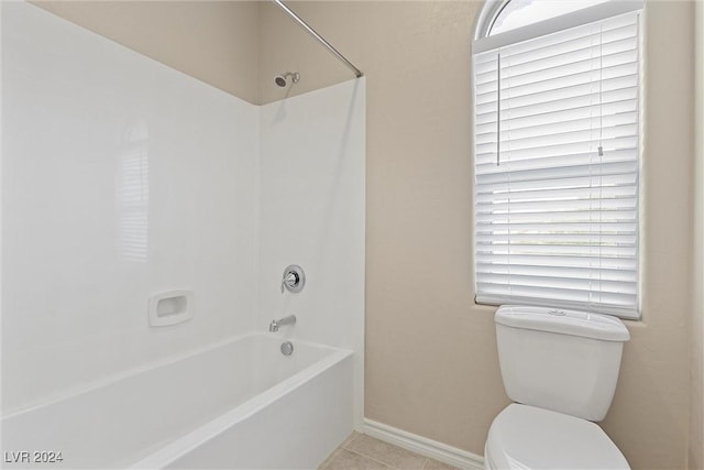 bathroom with toilet, tile patterned floors, and  shower combination