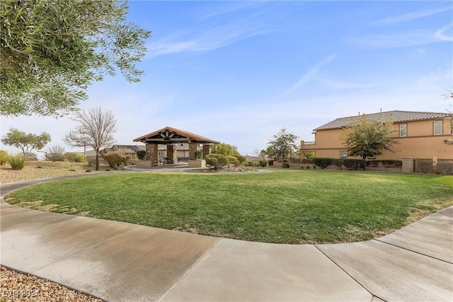 view of property's community with a lawn