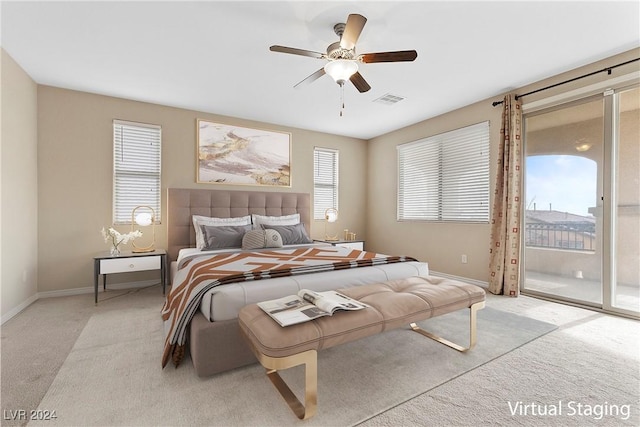 bedroom featuring light carpet, access to outside, and ceiling fan