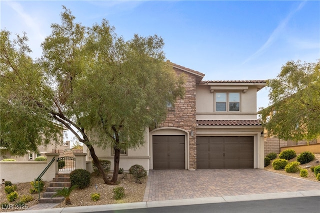 mediterranean / spanish house featuring a garage