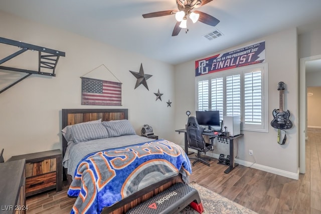 bedroom featuring hardwood / wood-style flooring and ceiling fan