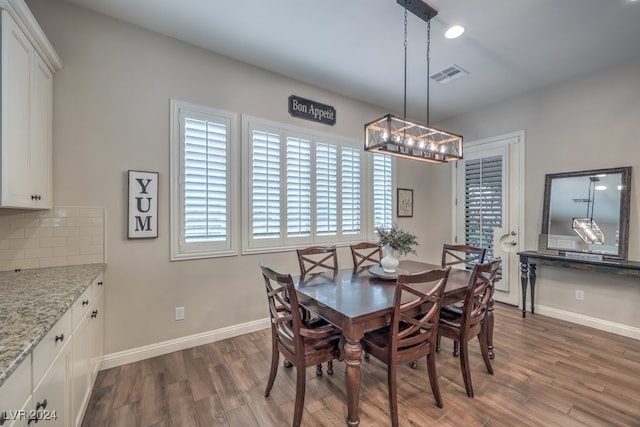 dining area featuring dark hardwood / wood-style floors