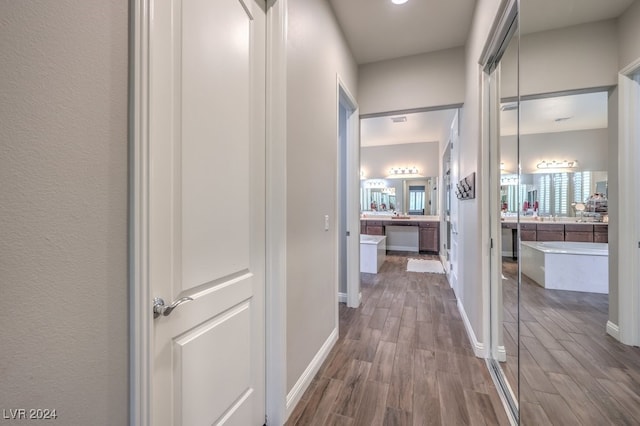 corridor featuring hardwood / wood-style floors