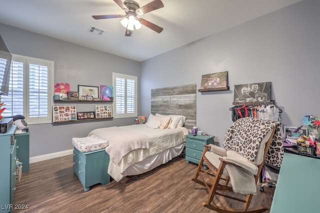 bedroom with ceiling fan and dark hardwood / wood-style flooring