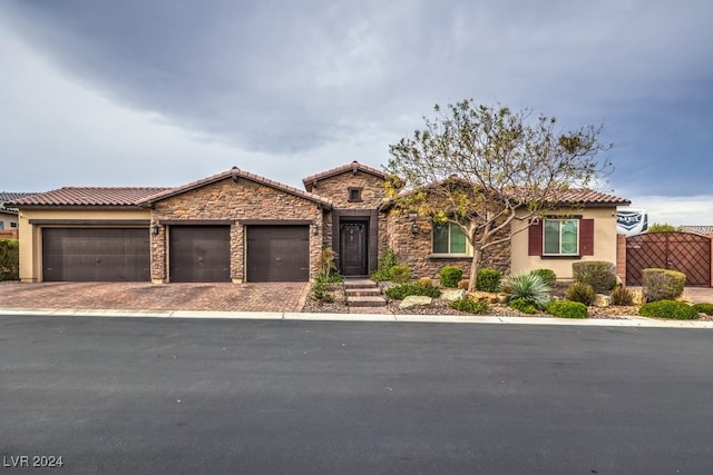 mediterranean / spanish-style home featuring a garage