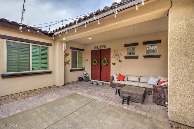 doorway to property featuring a patio and an outdoor hangout area