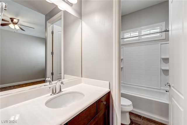 8351 Agave Bloom St, Las Vegas, NV 89131 - bathroom with toilet, vanity, ceiling fan, wood finished floors, and shower / tub combination
