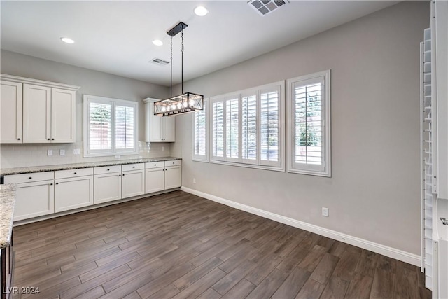 8351 Agave Bloom St, Las Vegas, NV 89131 - kitchen featuring baseboards, white cabinets, dark wood-style flooring, recessed lighting, and a chandelier