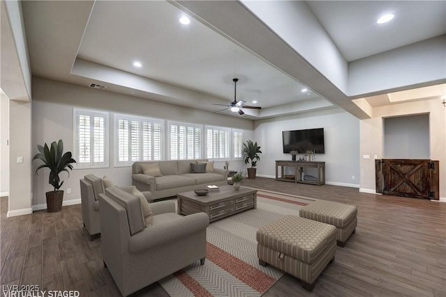 8351 Agave Bloom St, Las Vegas, NV 89131 - living room with baseboards, wood finished floors, ceiling fan, recessed lighting, and a raised ceiling