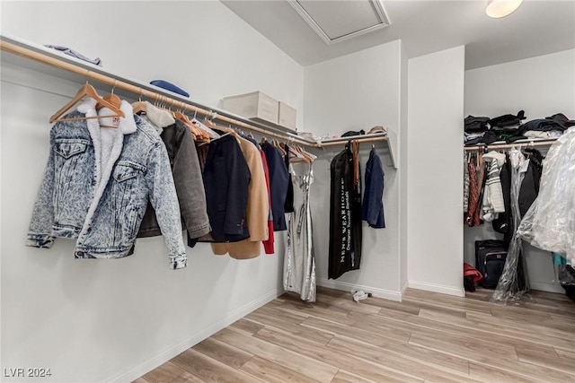 walk in closet featuring hardwood / wood-style flooring