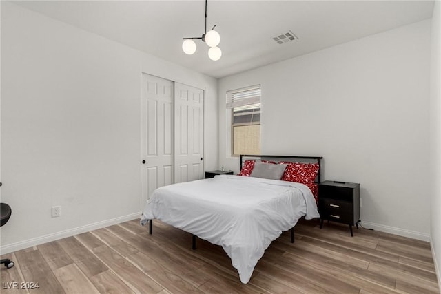 bedroom featuring hardwood / wood-style flooring and a closet