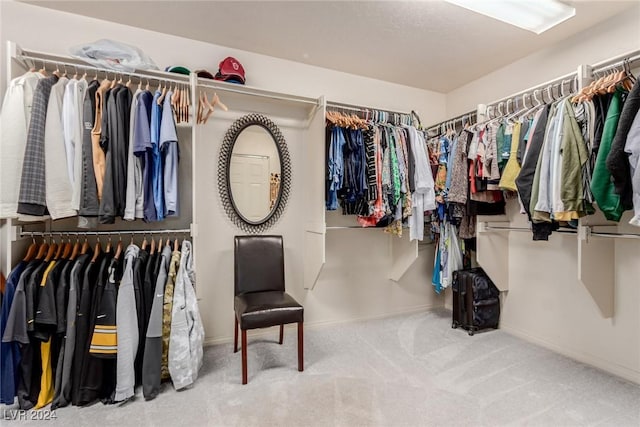 walk in closet with carpet floors