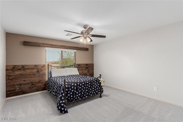 bedroom with ceiling fan and light colored carpet