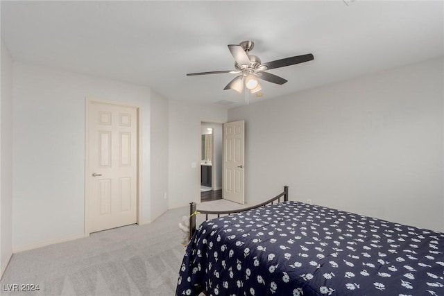 bedroom featuring ceiling fan and carpet