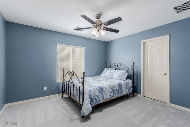 bedroom with light colored carpet and ceiling fan