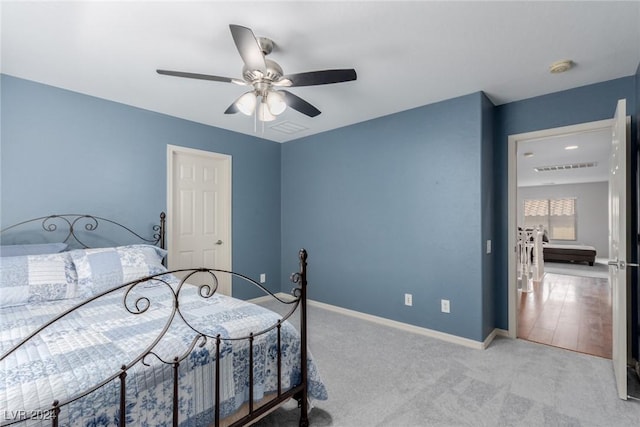 carpeted bedroom featuring ceiling fan