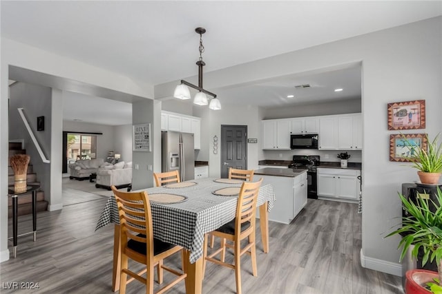 dining room with light hardwood / wood-style floors