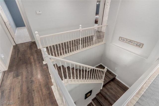 stairway featuring hardwood / wood-style flooring