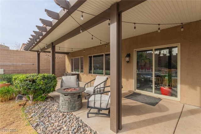 view of patio with an outdoor fire pit