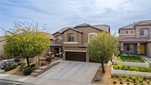 mediterranean / spanish-style home featuring a garage