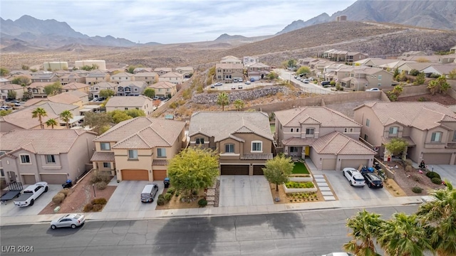 birds eye view of property with a mountain view