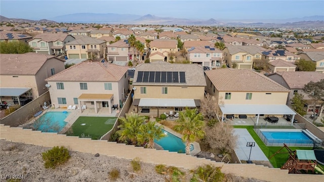 birds eye view of property featuring a mountain view