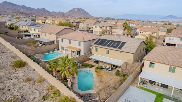 birds eye view of property with a mountain view