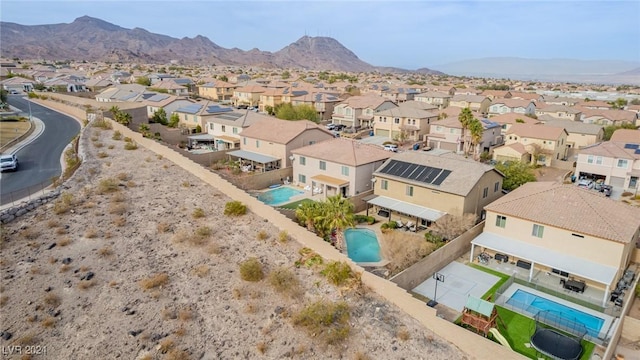 birds eye view of property featuring a mountain view