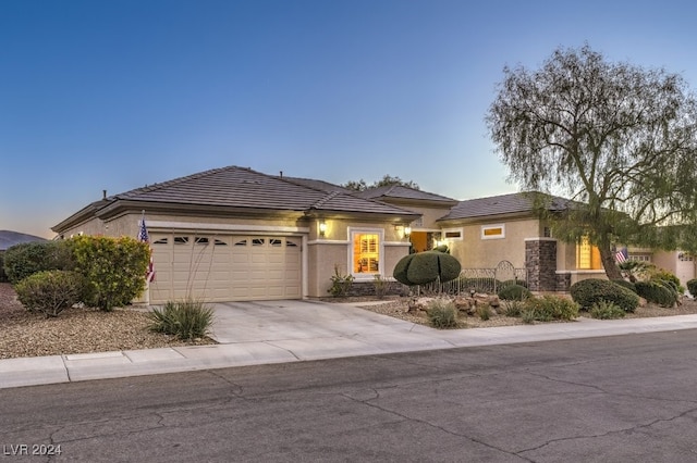 view of front of property with a garage