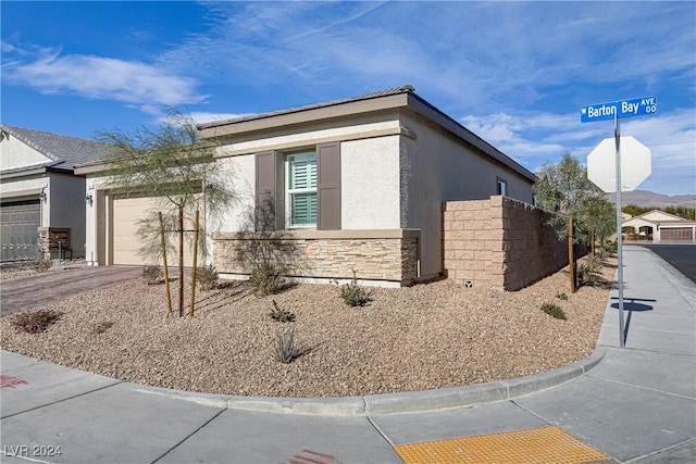 view of side of property with a garage