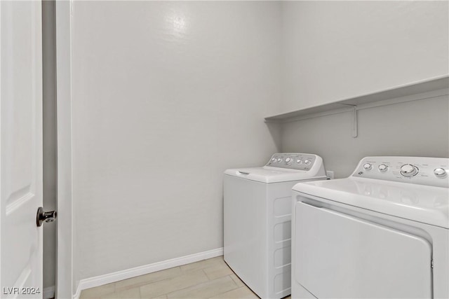 washroom with independent washer and dryer