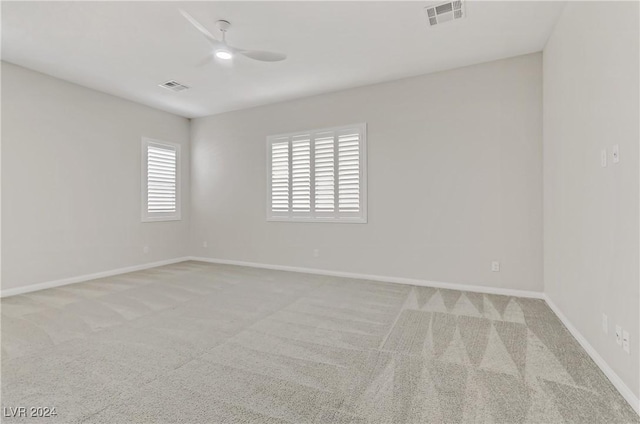 carpeted empty room with ceiling fan