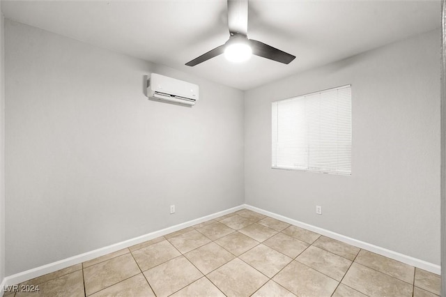 unfurnished room featuring light tile patterned floors, baseboards, a ceiling fan, and a wall mounted AC