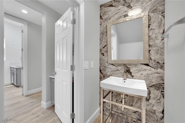 bathroom featuring sink and hardwood / wood-style floors