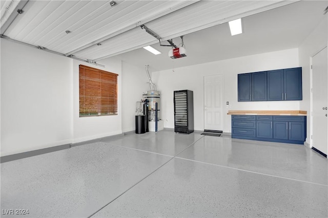 garage featuring secured water heater and a garage door opener