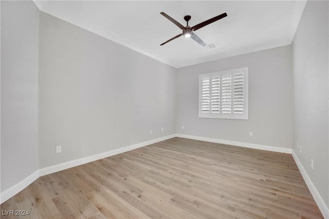 spare room with ceiling fan and light wood-type flooring