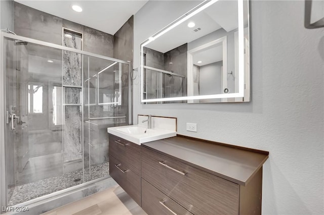 bathroom featuring vanity and walk in shower