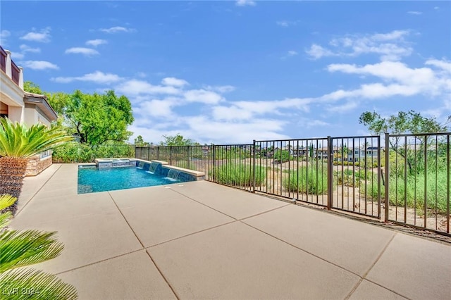 view of pool with pool water feature and a patio