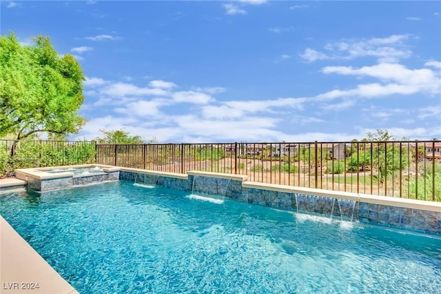 view of swimming pool featuring an in ground hot tub and pool water feature