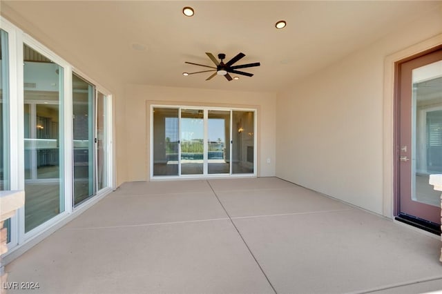 view of patio featuring ceiling fan