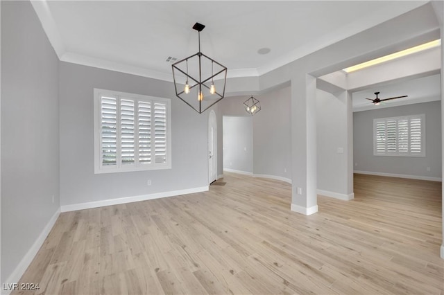 interior space with light hardwood / wood-style flooring, ceiling fan with notable chandelier, and ornamental molding