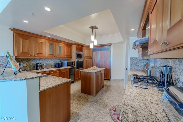 kitchen with built in appliances, light stone counters, a kitchen island, and pendant lighting